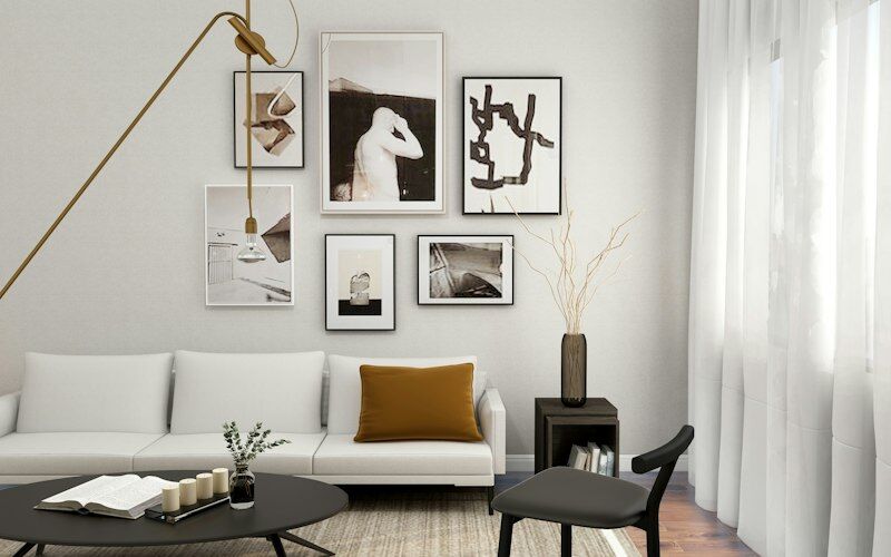 Phòng khách với sofa trắng và tranh treo tường